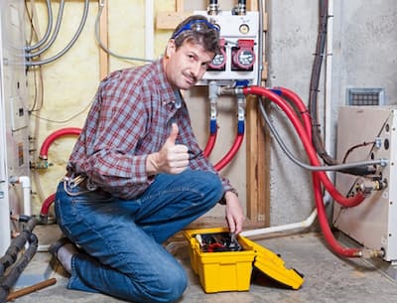 hvac technician holding a thumbs up sign